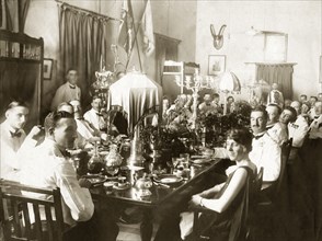 Regimental lunch at Mhow cantonment. British officers and their wives attend a regimental lunch at