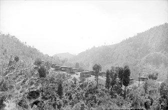 A Karen village. View of a Karen village set in a mountainous forest clearing. Burma (Myanmar),