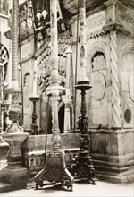Tomb of Jesus, Jerusalem. View of the large, elaborate candlesticks flanking the entrance to the