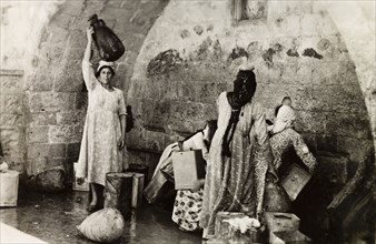 The Virgin's Fountain, Nazareth. Women collect water from the Virgin's Fountain (also known as