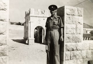 Policeman posing by chapel, Nazareth. Mr R. Denbeigh, a British police officer serving in
