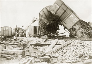 Derailed freight cars at Lydda. Several freight cars lie in a tangled heap, derailed in a sabotage