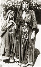 Portrait of two female 'bedouins'. Full-length portrait of an Arab woman and girl, identified in an