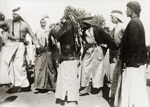 Dancing during a Nebi Musa procession. Muslim pilgrims dance to pipe music during a Nebi Musa