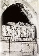 Carved stone sarcophagus, Palestine. A carved stone sarcophagus, decorated with an effigy and a