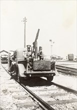 Rail trolley from Israel to Egypt. British soldiers armed with light mortar ride a rail trolley