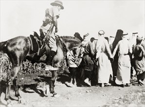 Escorting Arab detainees, Palestine. A mounted British soldier escorts a group of Palestinian Arab