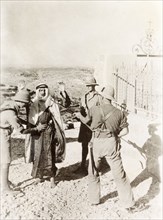 British soldiers searching a Palestinian Arab. Two British soldiers perform a body search on a