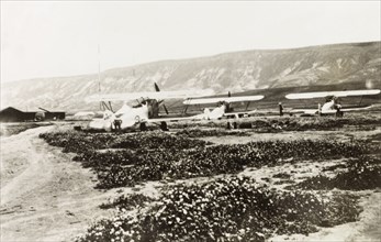 Royal Air Force biplanes, Palestine. Three Royal Air Force biplanes sit in an airfield in northern