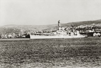 HMS Valiant at Haifa. View of the British battleship HMS Valiant, moored in the Mediterranean Sea