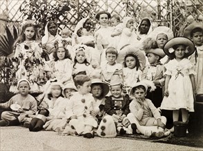 Children's fancy dress party, Calcutta 1911. Children at a fancy dress party pose for a group