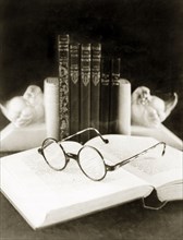 Front cover for a catalogue by 'James Murray & Co.'. Still life study of a pair of spectacles