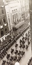 King George VI's coronation procession. Crowds of spectators line Whitehall to watch the coronation