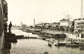 Port Said quayside, 1938. View of the quayside at Port Said. The department store 'Simon Artz' can