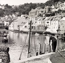 Polperro, Cornwall, 1952. Tightly-packed houses overlook the harbour at the picturesque fishing