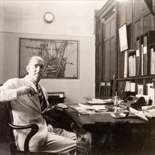 James Murray working in his office, Calcutta. James Murray sits at his desk in the James Murray &