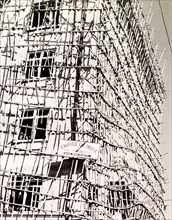 Bamboo scaffolding, Calcutta. A tall building is encased in bamboo scaffolding as it undergoes