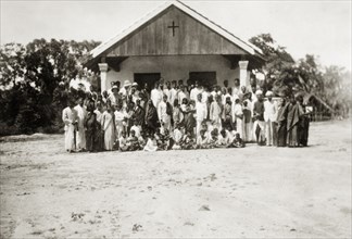 Church at 'Maskal Maradi' coffee estate. Plantation workers and their families pose outside a