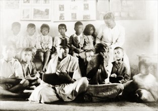Class of Indian schoolchildren. A mixed gender class of Indian schoolchildren listen and take notes