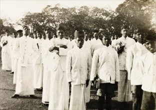 Students of a boy's mission school. Group portrait of uniformed male students of a Methodist