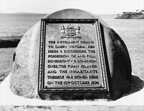 Memorial stone to Fijian cession. A bronze plaque is set on a stone overlooking Levuka harbour,