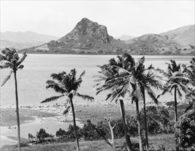 Rocky outcrop on Viti Levu. A distinctive rocky outcrop is seen across a bay on the eastern side of
