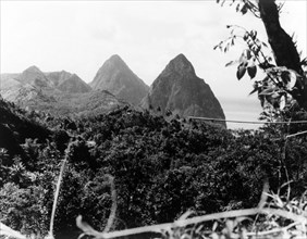 The Pitons, St Lucia. The Pitons rise up from the coastline of St Lucia. St Lucia, 1965., St Lucia,