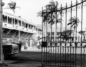 Gate onto the main square, Basseterre. An ornate iron gate belonging to government buildings opens