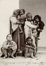 Child beggars, India. Portrait of a group of six children, including two infants, begging on the