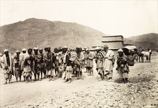 Pashtun men on the Kohat-Peshawar road. A group of Pashtun men gathered on the Kohat to Peshawar