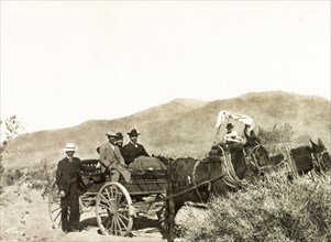 An expedition to Red Cloud gold mine. A group of European men travel by horse-drawn carriage to Red