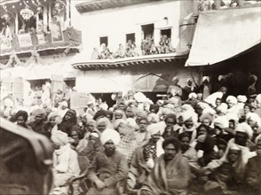 Spectators at the Coronation Durbar, 1903. Crowds of spectators gather on a Delhi street to catch a