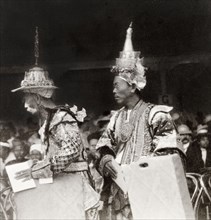 Shan chiefs at Coronation Durbar, 1903. Two elaborately dressed Shan chiefs take their seats in the