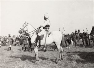 Indian dignitary at Coronation Durbar, 1903. Profile shot of an Indian dignitary mounted on