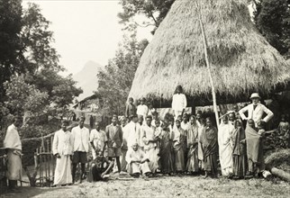 Methodist baptism ceremony, India. British missionary Reverend Norman Sargant poses with his
