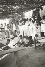Night school at 'Maskal Maradi' estate. Children attend a night school class at a Methodist mission