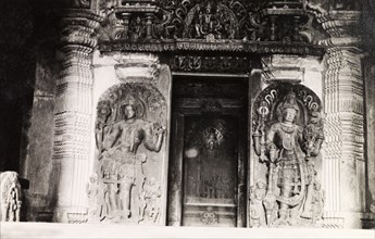 Sculptures at Chennakesava Temple. Two ornately sculpted 'doorkeepers' flank an image of Kesava