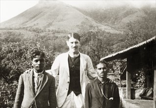 Missionaries at 'Doopadcool Estate'. British missionary Reverend Norman Sargant poses with two
