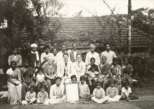 Reverend and congregation at Indian plantation. British missionary Reverend Norman Sargant (centre)