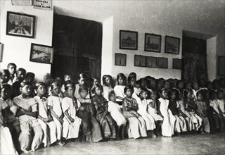 Chikmagalur Mission School. Primary school children at Chikmagalur Mission School sit in two long