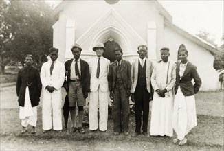 Reverend and staff of Chikmagalur Church. Group portrait of Reverend Norman Sargant (centre) posing