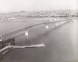 Auckland Harbour Bridge, 1966. Auckland Harbour Bridge stretches across Waitemata Harbour towards