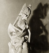 A Hindu figurine from Bali. A intricately carved figurine of a Hindu deity or 'devi' (goddess).