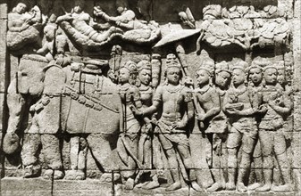 Relief panels at Borobudur . One of many relief panels at the ninth century Buddhist monument of