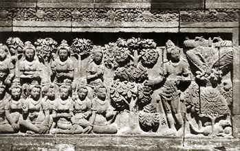 Relief panels at Borobudur . One of many relief panels at the ninth century Buddhist monument of