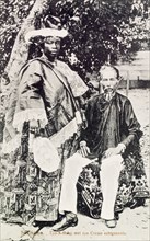 Creole woman with Asian husband, Suriname. Portrait of a creole woman posing next to her East Asian
