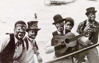 Blackface' calypso singers, Trinidad. A band of Trinidadian calypso singers put on a 'blackface'