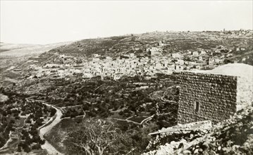 The village of Lifta, circa 1938. A twisting road winds its way down a hillside beneath the Arab