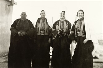 Women in traditional Palestinian attire. Group portrait of four women, dressed in traditional