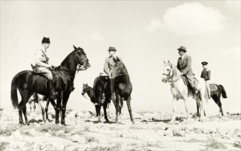 British officials ride out to meet Arab leaders. A delegation of British officials rides out across